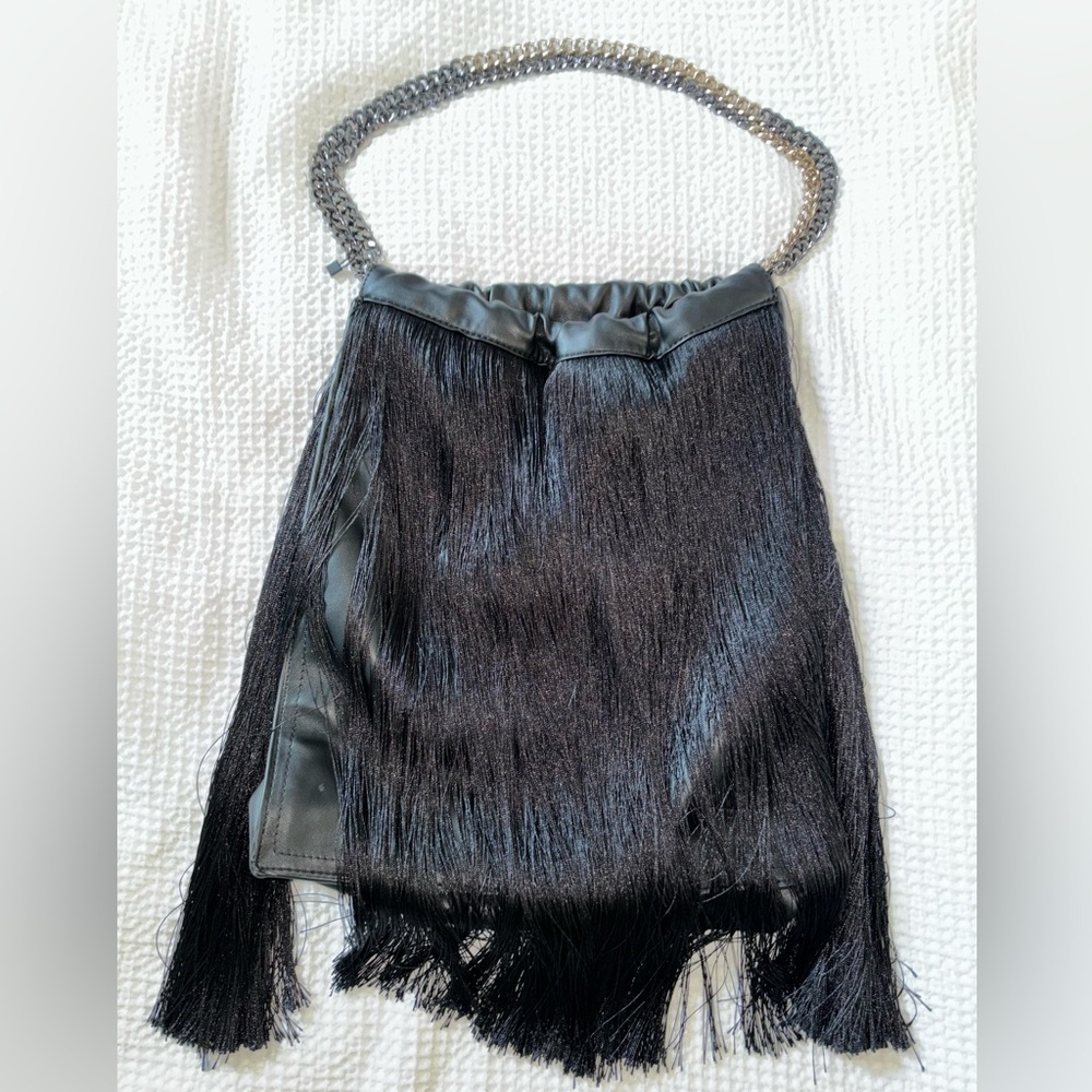 Lightly used Zara leather fringe black bag.